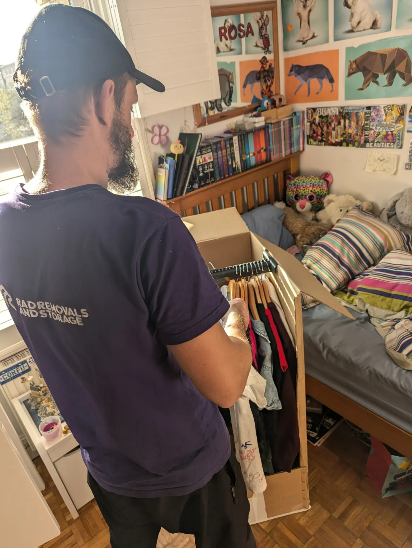 RAD team using wardrobe boxes to pack client’s clothes safely